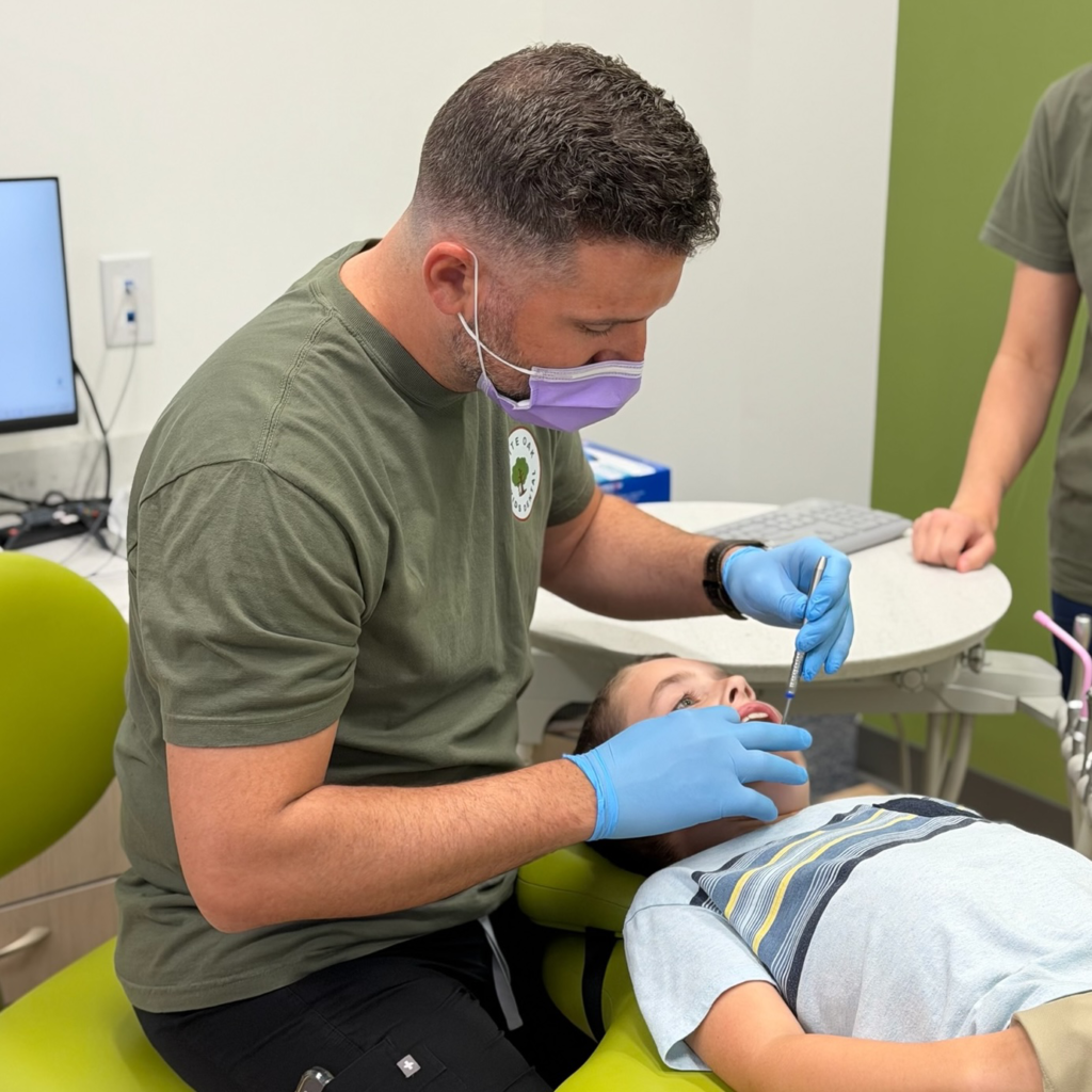 Dentist cleaning teeth